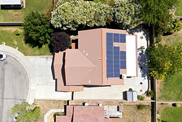 This spacious home features solar panels, expansive outdoor space, and convenient access to local amenities.