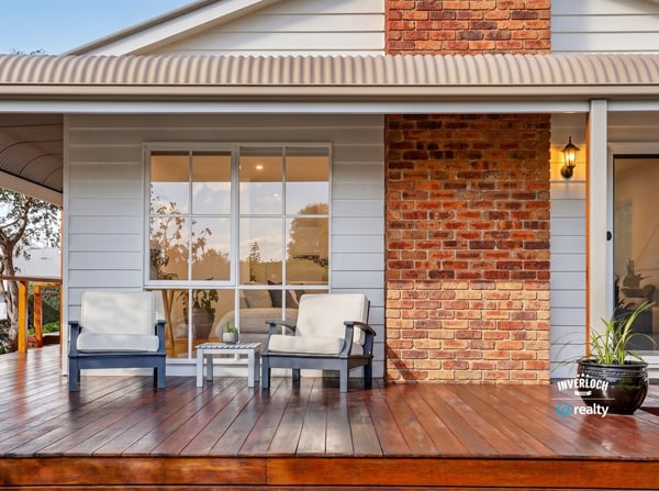 Relax on the spacious deck, featuring inviting seating and a blend of modern and classic design.