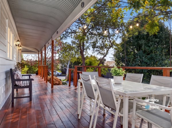Relax on this expansive deck with captivating views and ample space for entertaining family and friends.