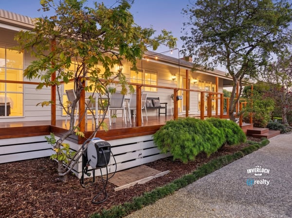 Discover this inviting home featuring a spacious deck, landscaped gardens, and modern amenities throughout.