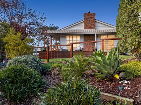 Discover a stunning home with expansive outdoor spaces and picturesque landscaping, perfect for relaxing or entertaining.