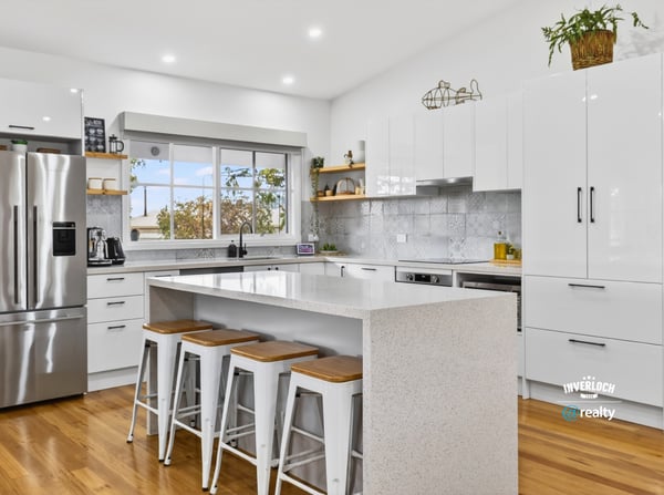 Bright, modern kitchen featuring sleek cabinetry, stainless steel appliances, and a spacious island for entertaining.