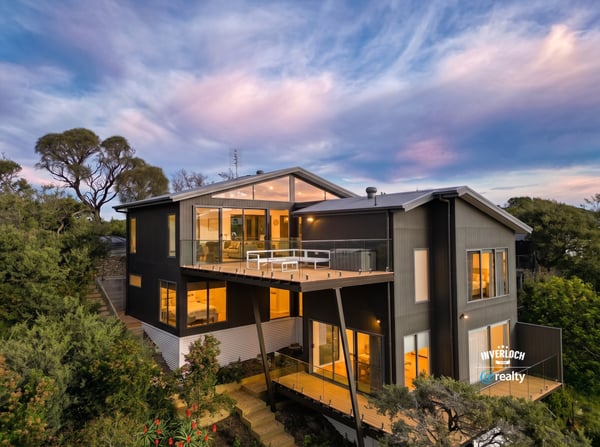 Contemporary home with expansive windows, offering breathtaking views and seamless integration with nature.