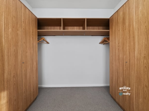 Spacious closet featuring ample storage with built-in shelving and hanging options for efficient organization.