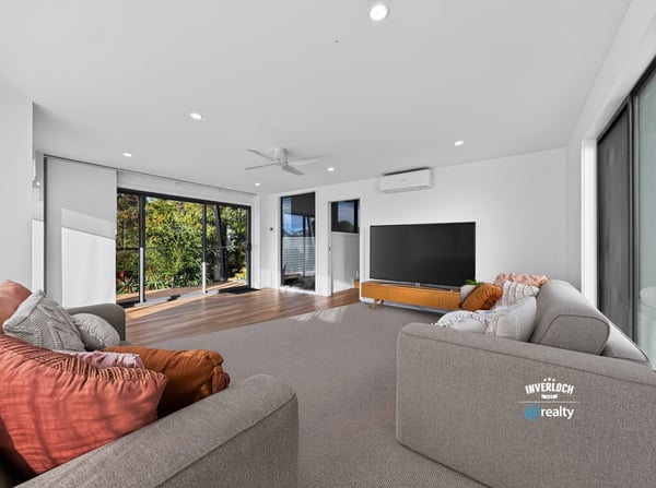 Bright and spacious living area with large windows, offering panoramic views and seamless indoor-outdoor flow.