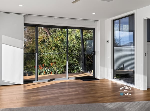 Bright and airy living space with large windows that offer stunning views of the outdoors.