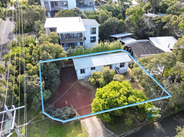 Spacious property surrounded by lush greenery, featuring potential for expansion and convenient access to amenities.