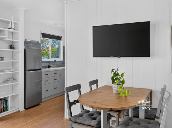 Bright open kitchen and dining area with modern appliances and inviting natural light for casual gatherings.