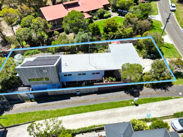 Modern home featuring spacious outdoor areas, situated on a beautifully landscaped lot with ample privacy.
