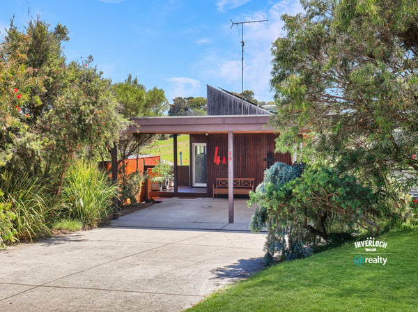 Discover this unique home surrounded by vibrant greenery, offering a seamless blend of indoor and outdoor living.
