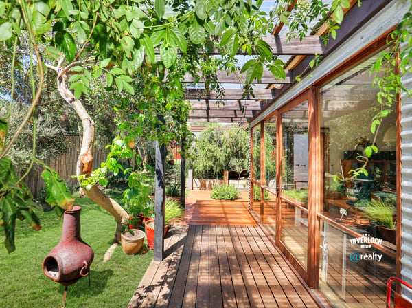 Bright and inviting outdoor space with lush greenery, perfect for relaxation and entertaining.