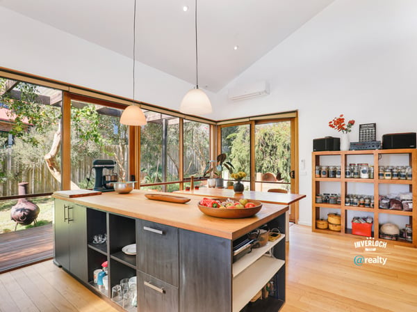 Bright and airy kitchen with expansive windows, featuring modern appliances and a spacious island for entertaining.