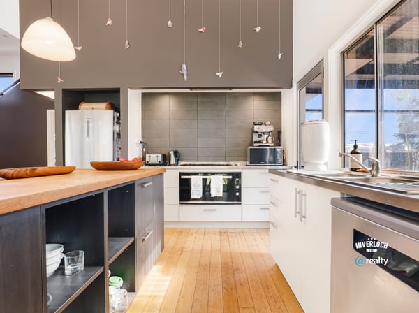Contemporary kitchen featuring modern appliances, spacious countertops, and unique decorative accents for a vibrant cooking space.