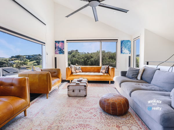 Bright and spacious living area featuring panoramic views, modern furnishings, and ample natural light throughout.