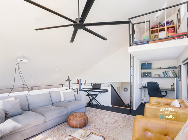 Contemporary loft with abundant natural light, featuring an open layout and versatile office space.