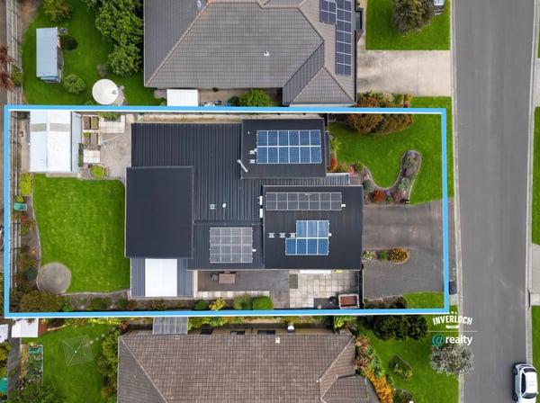 Spacious property featuring ample outdoor space and modern solar panel installation in a vibrant neighborhood.