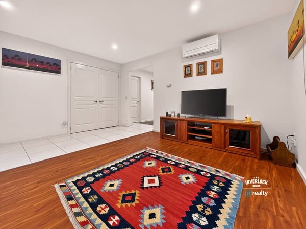 Bright and welcoming living space featuring modern amenities, vibrant decor, and versatile layout for comfort.
