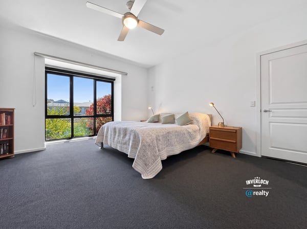 Bright and airy bedroom with large windows, offering stunning views and ample natural light.