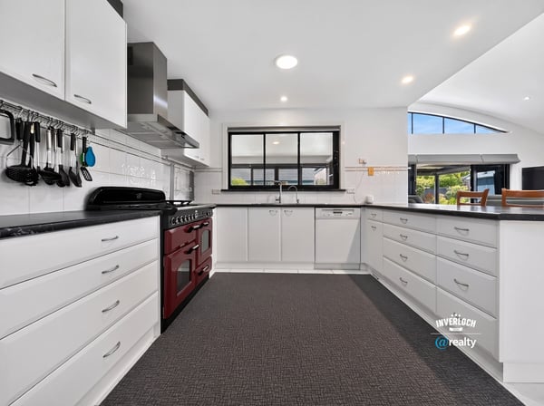 Modern kitchen featuring ample storage, high-end appliances, and a spacious layout perfect for culinary enthusiasts.