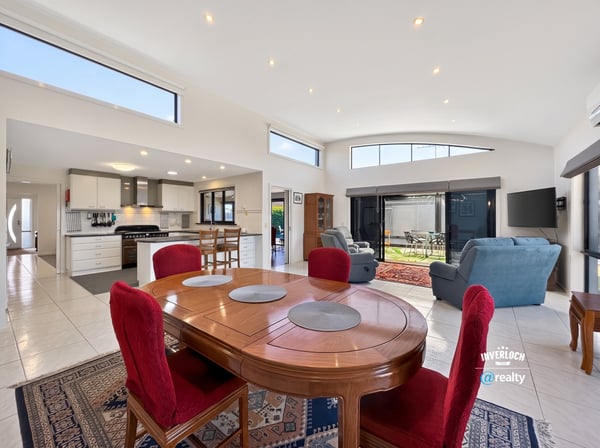 Bright, open-concept living area featuring spacious dining and a modern kitchen, perfect for entertaining.