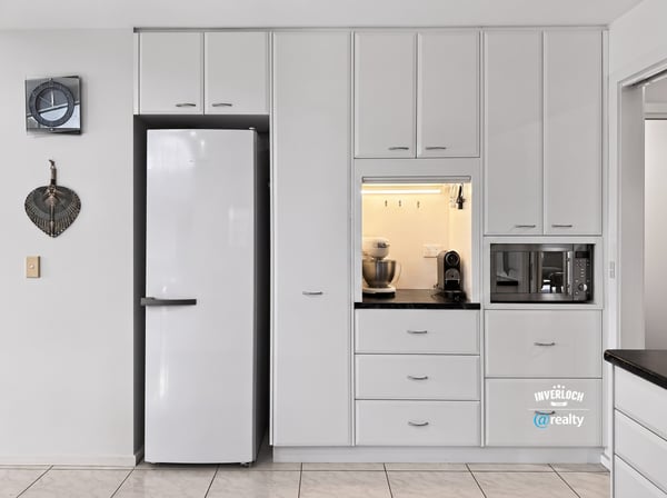 Modern kitchen featuring sleek cabinetry, ample storage, and integrated appliances for effortless cooking and entertaining.