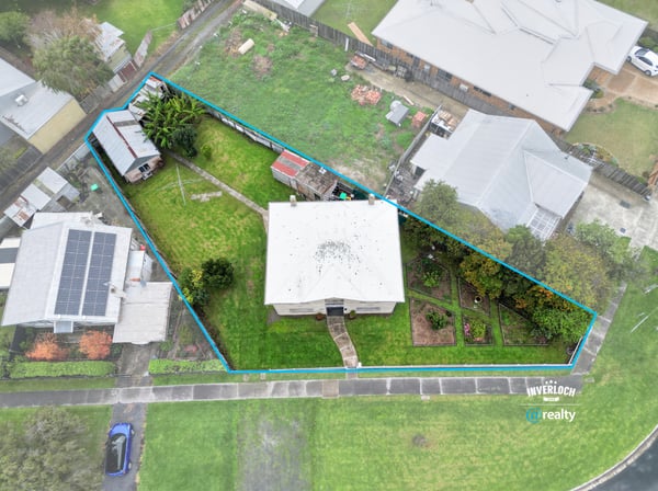 Spacious property featuring a large yard, multiple outbuildings, and convenient access to local amenities.
