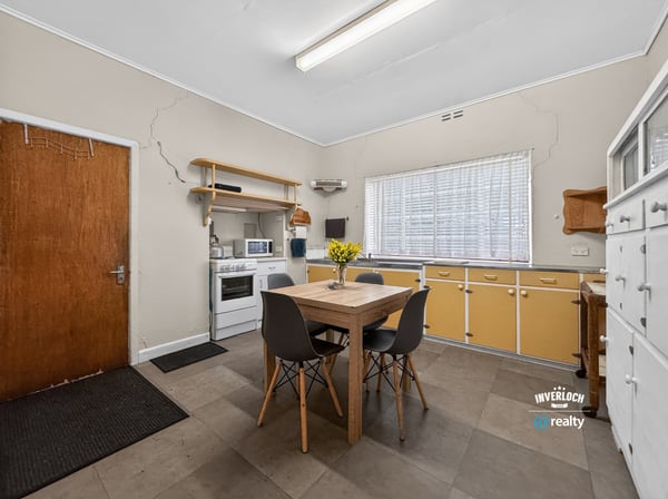 Bright and functional kitchen featuring ample storage, modern appliances, and a cozy dining area for gatherings.