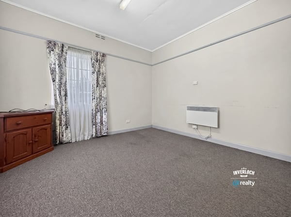 Bright, versatile room featuring ample natural light and neutral tones, perfect for various layout possibilities.