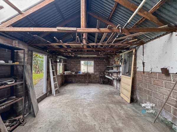 Spacious workshop with open layout, ample natural light, and potential for customization to suit your needs.