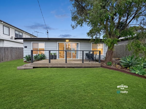 This inviting home features a spacious backyard and modern deck, perfect for outdoor gatherings and relaxation.