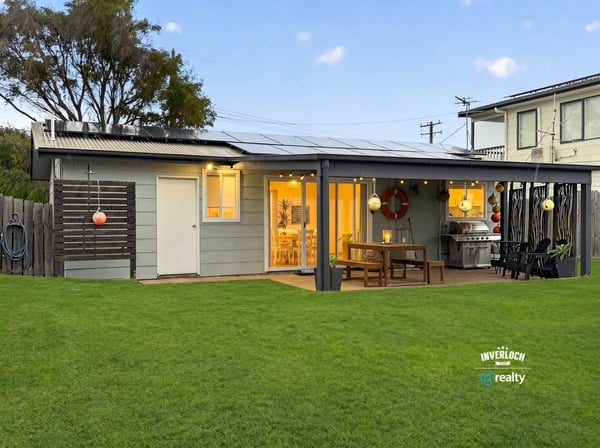 This modern home features a spacious yard, inviting patio area, and ample natural light throughout.