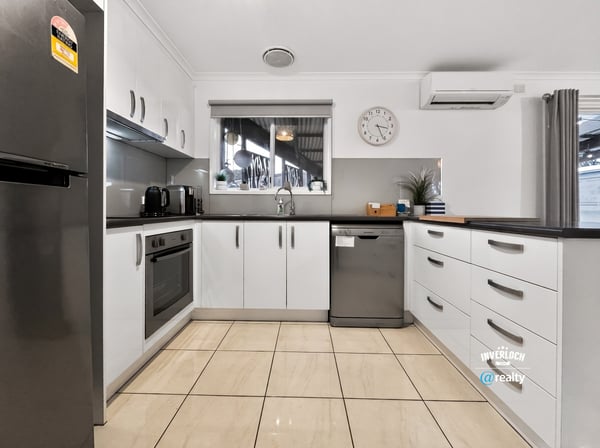 Modern kitchen featuring ample storage, stainless steel appliances, and a spacious layout for culinary creativity.
