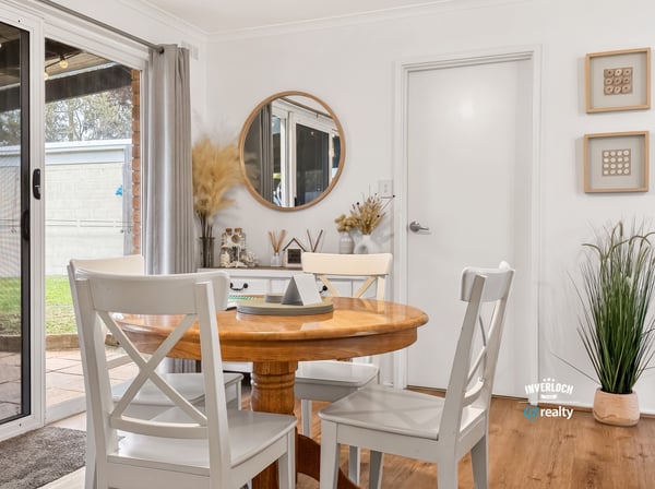 Bright dining area featuring natural light, modern decor, and easy access to outdoor space.
