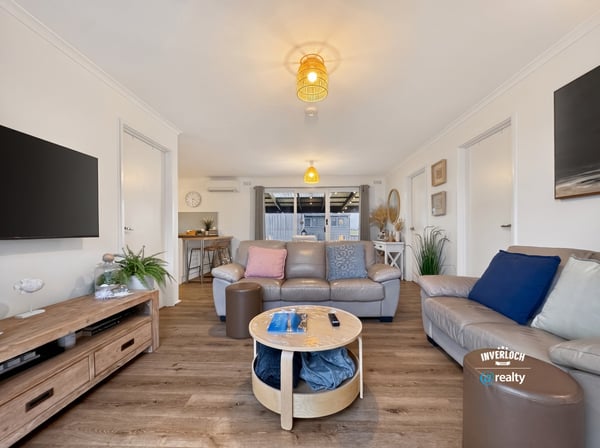 Spacious living area featuring modern amenities and abundant natural light, perfect for relaxation and entertaining.