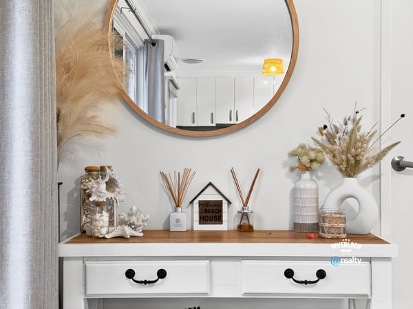 Discover a welcoming entryway featuring unique decor, creating an inviting atmosphere for every guest.