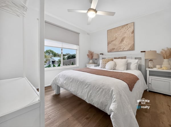 This inviting bedroom features a spacious layout, abundant natural light, and contemporary decor for comfortable living.