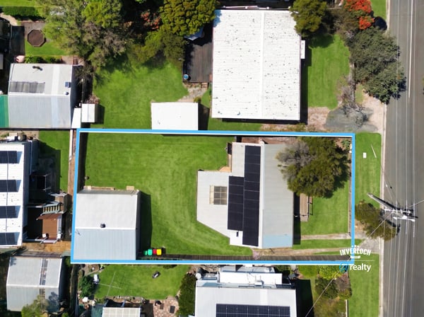 Spacious lot with ample outdoor space, featuring a well-maintained home and multiple storage options close to amenities.