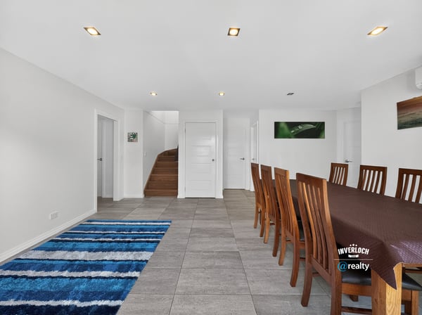 Spacious dining area features modern finishes, natural light, and a seamless flow to adjacent living spaces.
