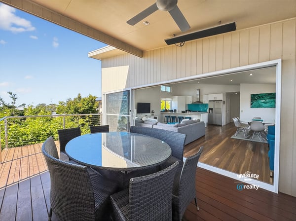 Experience seamless indoor-outdoor living with this inviting patio and expansive views of the surrounding greenery.