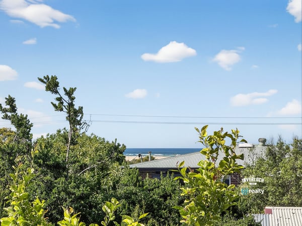 Enjoy stunning coastline views from this elevated property, surrounded by lush greenery and peaceful ambiance.
