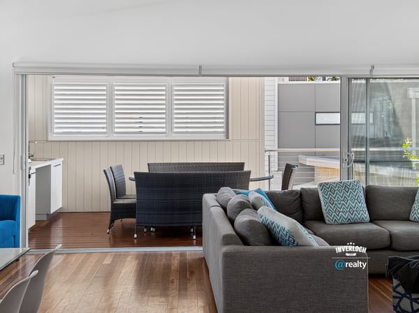 Bright and spacious living area seamlessly connects to a private outdoor space, perfect for relaxation.