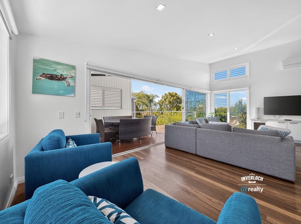 Modern open-concept living space featuring ocean views, ideal for entertaining and relaxation.