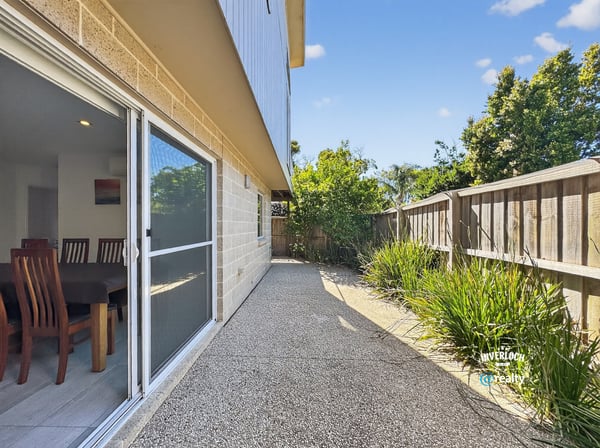 Spacious outdoor area offers a low-maintenance retreat, perfect for lounging or entertaining guests.