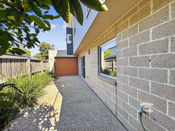 Contemporary home featuring a unique façade, private driveway, and landscaped outdoor space. Perfect for modern living.