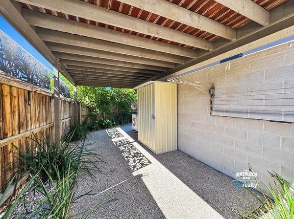 Discover a private outdoor space featuring ample shade, perfect for relaxation or entertaining.