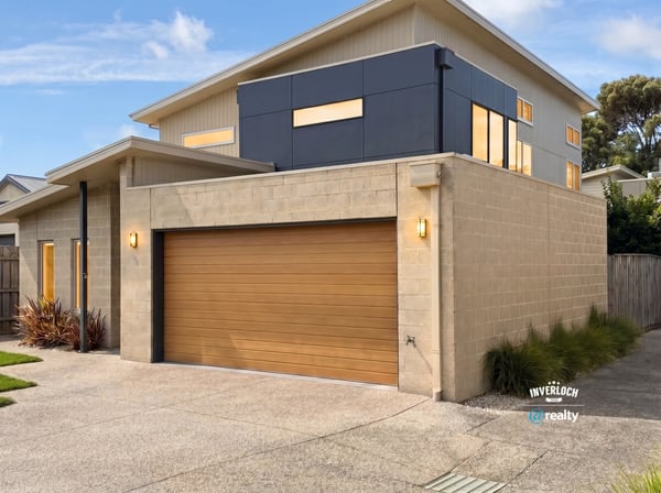 Modern two-story home featuring spacious interiors and a unique architectural design, perfect for contemporary living.