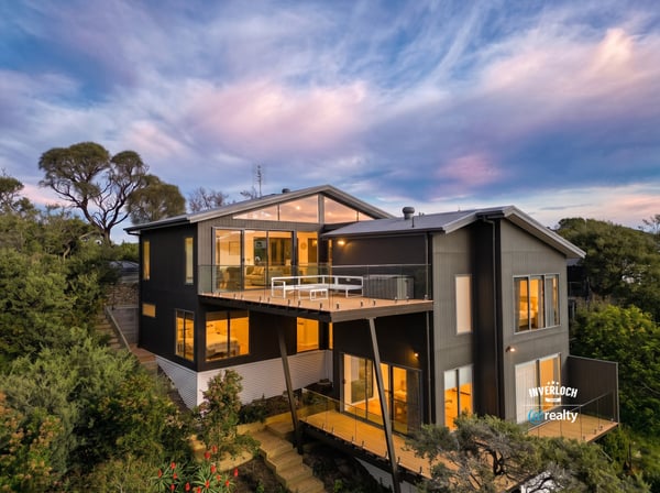 Contemporary home with expansive windows, offering breathtaking views and seamless integration with nature.