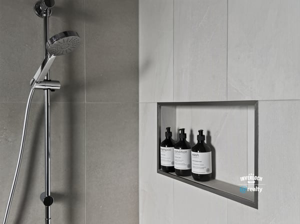 Modern shower featuring a sleek design and built-in niche for organized storage of essentials.