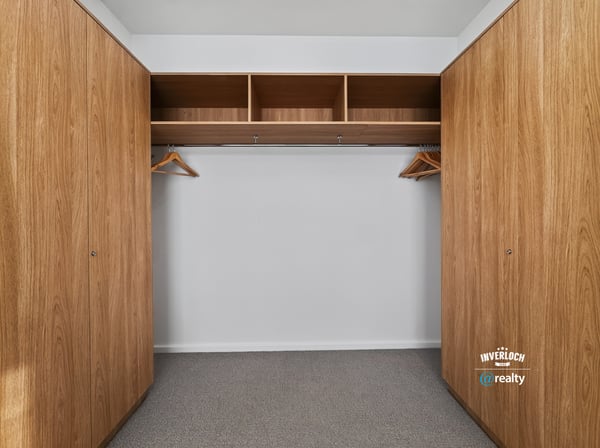 Spacious closet featuring ample storage with built-in shelving and hanging options for efficient organization.