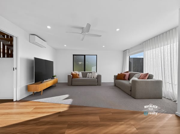 Bright and spacious living area features modern finishes and abundant natural light, perfect for relaxation.